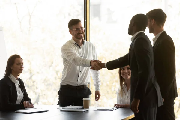 Boss shake hands with multi racial business partners starting negotiations — Stock Photo, Image