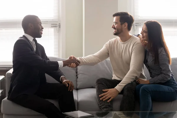 Couple purchasing realty feels satisfied shake hands thanking financial advisor — Stock Photo, Image