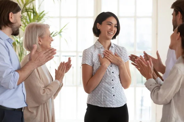 Overjoyed colleagues applaud Korean team leader greeting with success — Stock Photo, Image