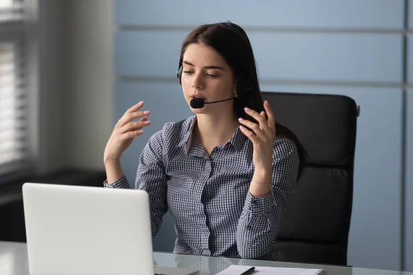 Woman wearing headset provide technical support working at customer service center — Stock Photo, Image