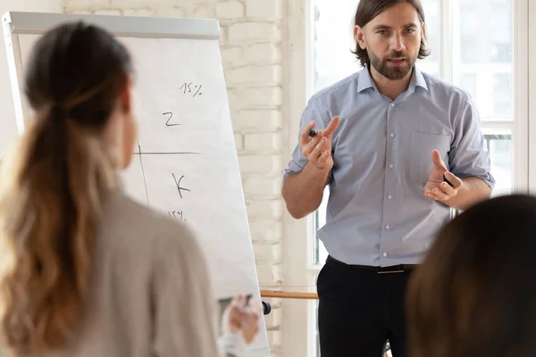Motivated male speaker make whiteboard presentation for colleagues — Stock Photo, Image
