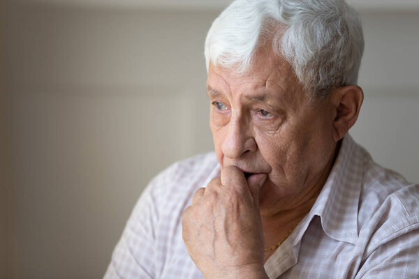 Close up of sad elderly man missing wife