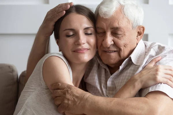 Loving mature dad and daughter cuddle at home together — Stock Photo, Image