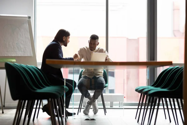 Diverse colleagues working on project together, sitting in boardroom — Stock Photo, Image