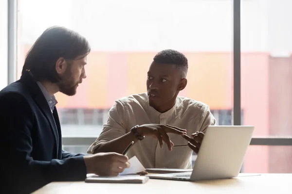 African American manager consulting client about insurance at meeting — Stock Photo, Image