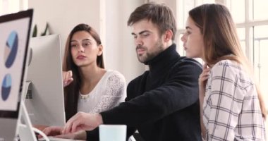 Focused business analysts team listening male leader analyze pc data