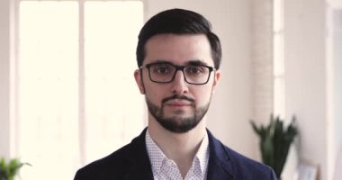 Smiling young businessman professional wear suit looking at camera