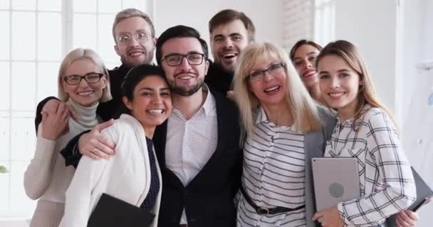 Happy successful multiethnic team looking at camera bonding, business portrait — Wideo stockowe