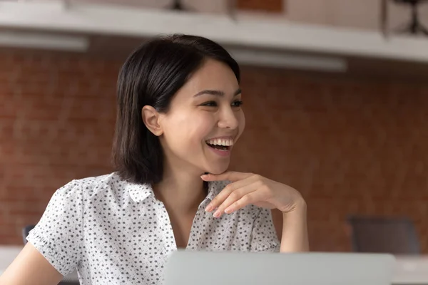 Smiling female employee laugh talking with colleague — Stock Photo, Image