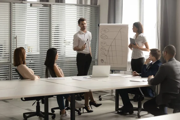 Male coach make whiteboard presentation at office briefing — ストック写真