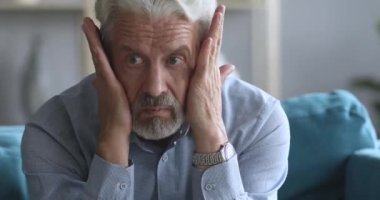 Worried older mature man suffering from depression.