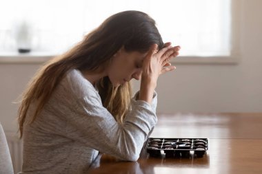 Pensive girl with eating disorder think of chocolates