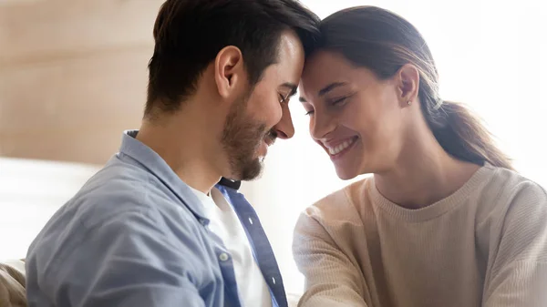 Happy young couple hug enjoying romance at home — 图库照片