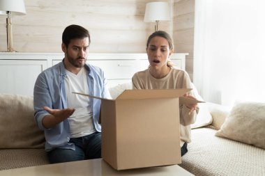 Disappointed couple clients frustrated with inline shopping