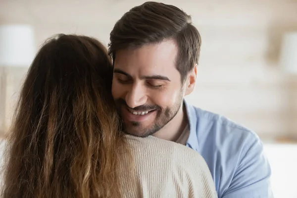 Smiling man hug beloved wife reconcile after fight — 图库照片