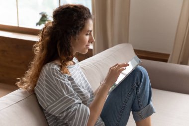 Addicted to technology millennial lady chatting in social networks.