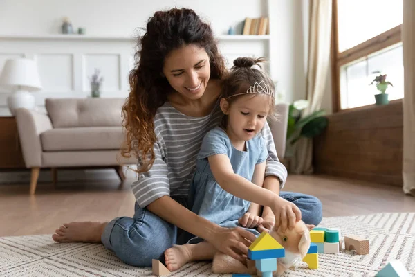 Smiling nanny having fun with child at home. — Stock Photo, Image