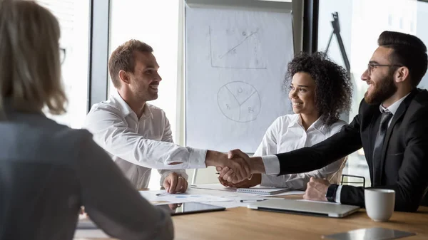 Different ethnicity businessmen shaking hands starting negotiations — Stock Photo, Image