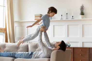 Two generations family playing together at home.