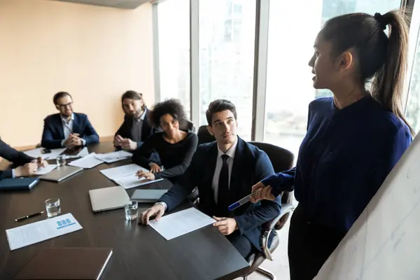 Confident businesswoman lead flip charts presentation new project in boardroom. — Stockfoto