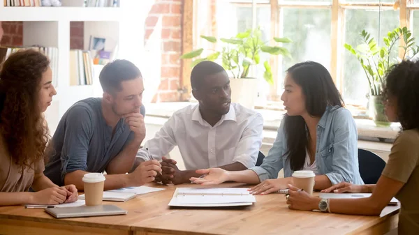 Horizontal photo diverse employees team discussing project at meeting — ストック写真