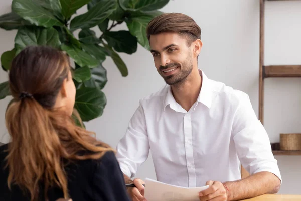 Smiling hr manager talking with candidate on job interview — Stockfoto