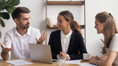 Colleagues working on project together, discussing startup ideas