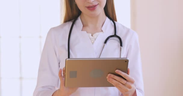 Close up view of female doctor use touchscreen digital tablet — ストック動画