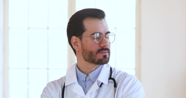 Confident male doctor look away dreaming thinking of future vision — Stok video