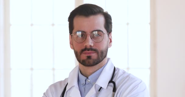 Happy confident male professional medic doctor close up portrait — Stockvideo