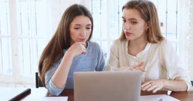 Female teacher mentor explain marketing data training intern with laptop