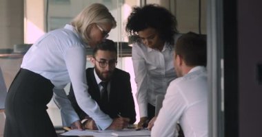 Different generations mixed race business people developing company strategy.