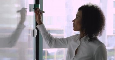 Confident female speaker coach preparing for presentation.