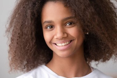 Headshot portrait of african american teen girl looking at camera clipart