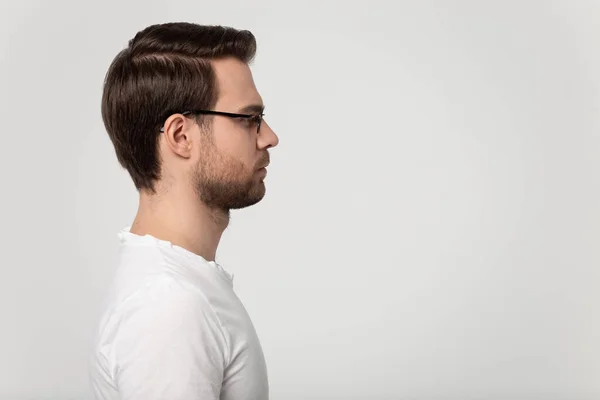 Side profile view close up young man looking at copyspace. — Stock Photo, Image