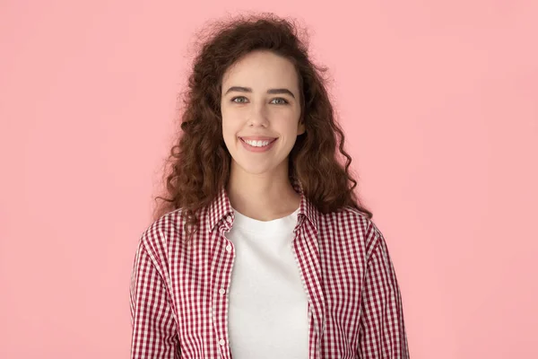 Happy smiling sincere millennial curly woman head shot portrait. — Stockfoto