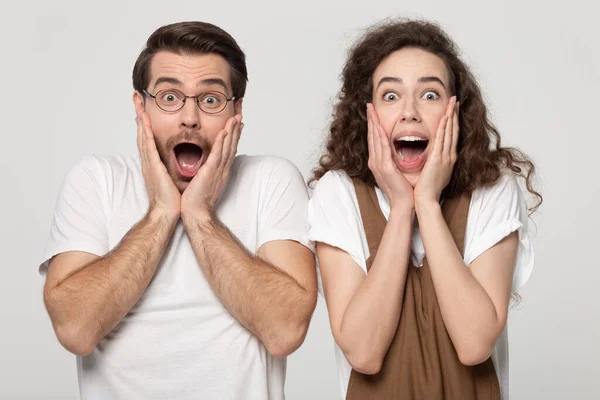 Astonished millennial guy and woman winners amazed by unbelievable news. — 스톡 사진