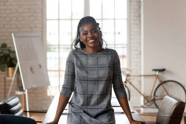 Successful confident african businesswoman looking at camera posing in boardroom — Stock Photo, Image