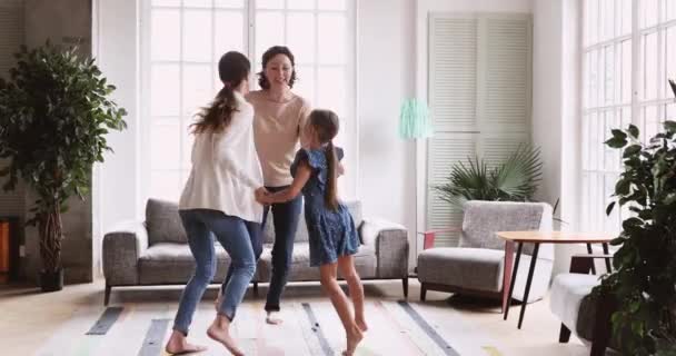 3 three age generations women family dancing in living room — Stockvideo