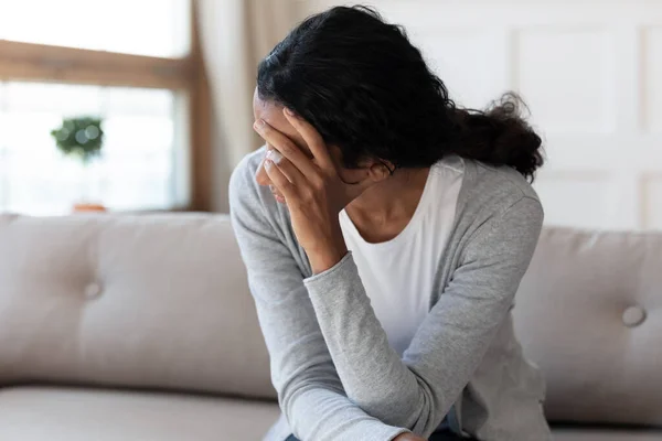 Unhappy biracial woman look in distance feeling depressed — Stok fotoğraf