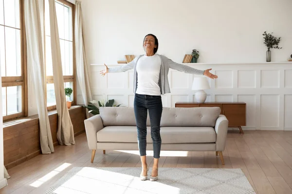 Happy african American woman dancing at home in living room — Stockfoto