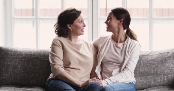 Happy daughter and mature mum talking laughing looking at camera — Stock Video