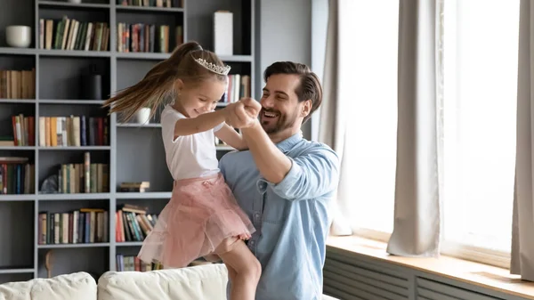 Happy dad and preschooler daughter dance have fun at home — Stock Photo, Image