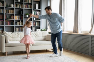 Happy father have fun play with little daughter