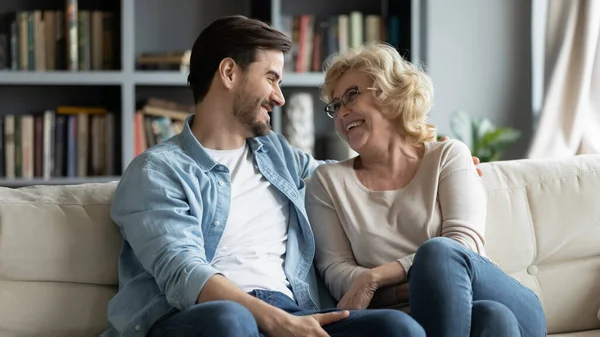 Overjoyed mature mother and adult son have fun at home — Stock Fotó