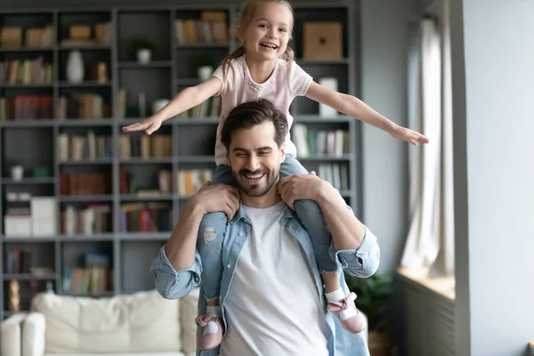 Smiling young dad have fun play with little daughter — Stock Photo, Image
