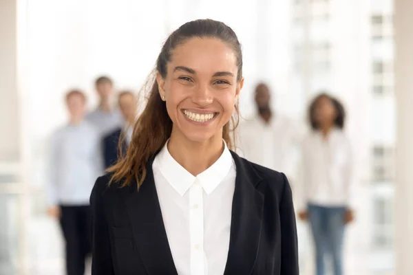 Close up portrait smiling mixed race businesswoman in office. — Stock Photo, Image