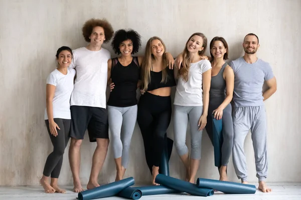 Group of multi-ethnic slim people photo shooting after workout