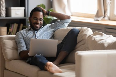 Dreamy young mixed race guy dating online in social network.