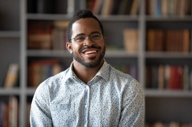 Head shot portrait of happy young african american businessman.